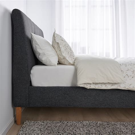 The sloping headboard and soft upholstery make IDANS upholstered bed frame extra comfortable. . Ikea bed frane
